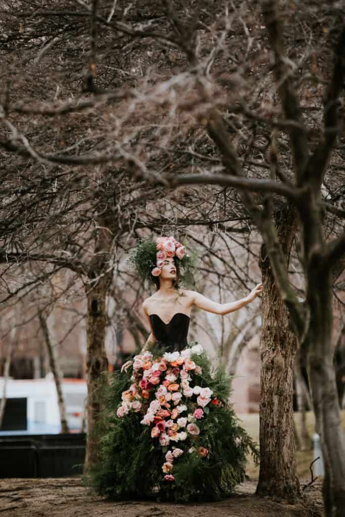A gown designed from Fresh Roses and Greenery. Decadent Floral headpiece.